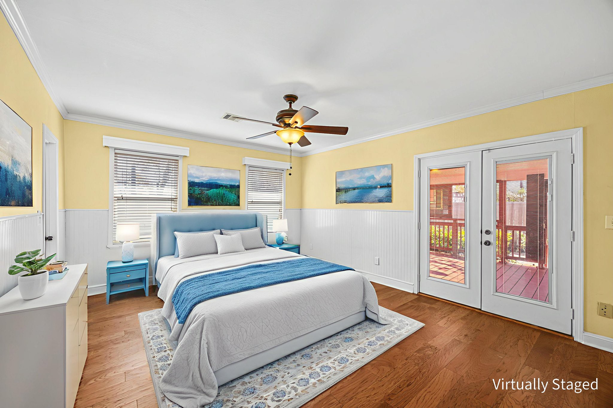 710 East 28th Street Houston, TX 77009 - Photo 10 of 44 a bedroom with a large bed and a chandelier