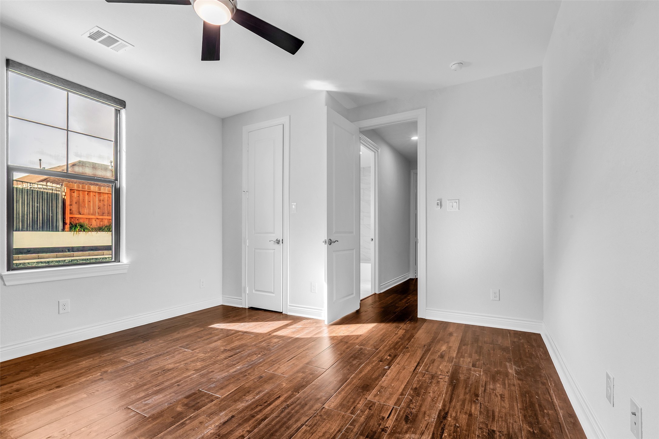 17 Bellingham Court Montgomery, TX 77356 - Photo 25 of 47 a view of an empty room with wooden floor and a window