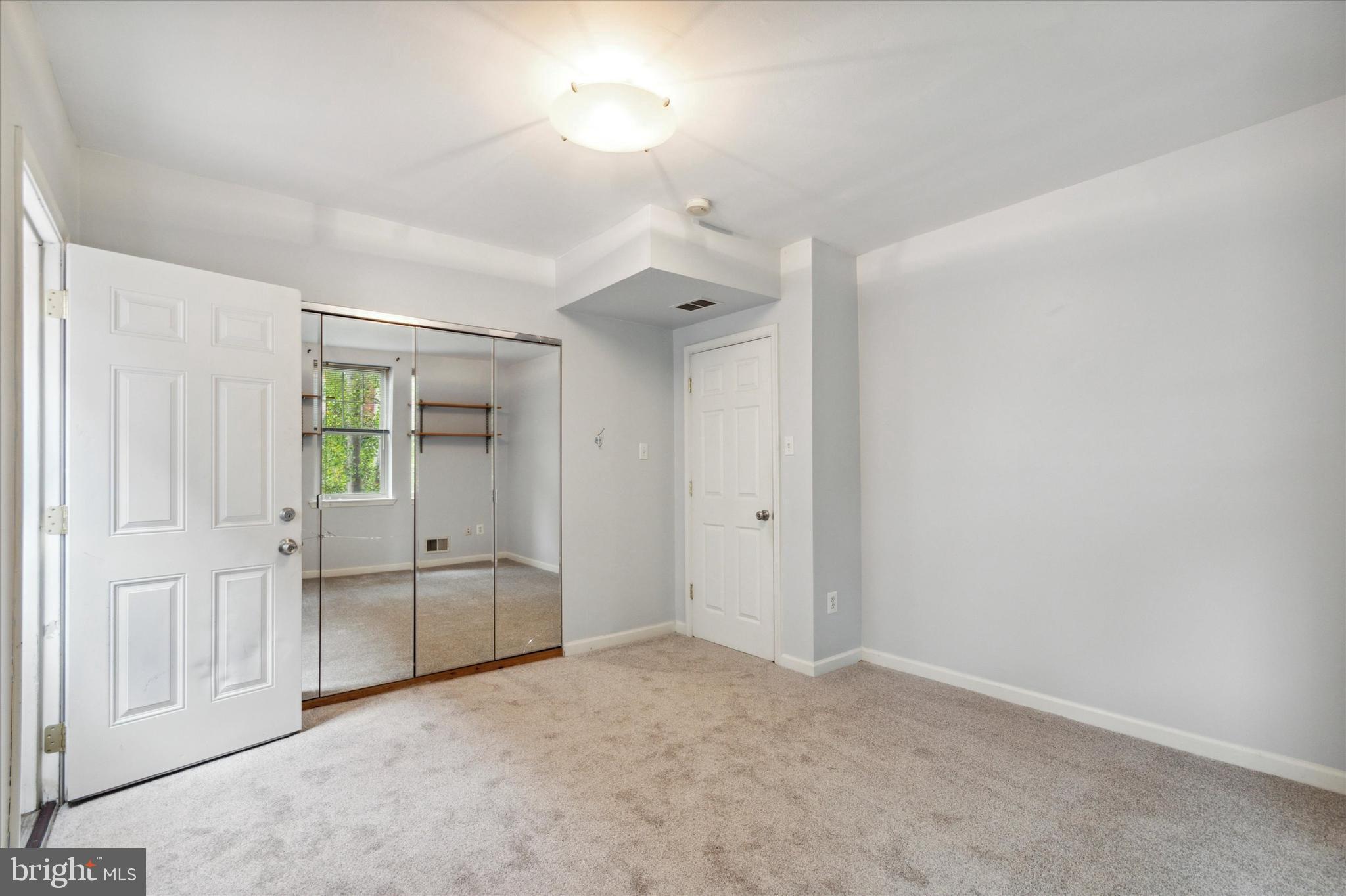 1918 Poplar Street, Unit 2 Philadelphia, PA 19130 - Photo 7 of 18 2nd floor bedroom, door to deck