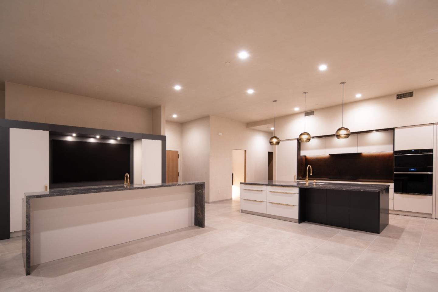 520 Lighthouse Avenue, Unit 301 Pacific Grove, CA 93950 - Photo 7 of 14 a living room with stainless steel appliances kitchen island a flat screen tv and a couch