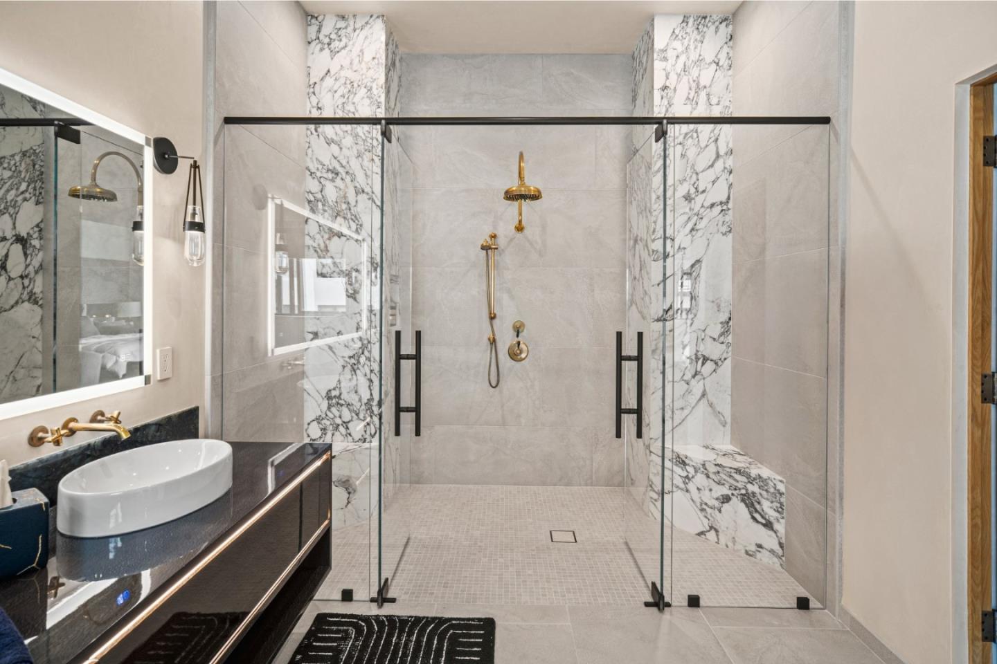 520 Lighthouse Avenue, Unit 301 Pacific Grove, CA 93950 - Photo 9 of 14 a bathroom with a granite countertop shower a sink and a mirror