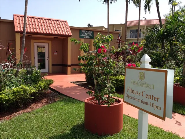 a view of a wooden door with a sign board