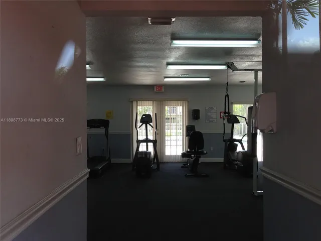 a view of swimming pool with outdoor seating and a projector