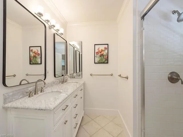 a bathroom with a granite countertop sink mirror and vanity