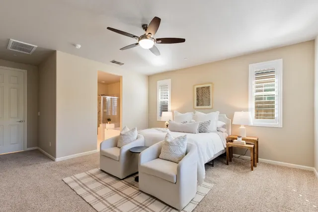 a bathroom with a granite countertop sink a large mirror and a shower