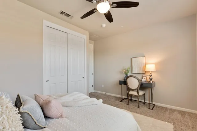 a bathroom with a granite countertop sink a toilet and shower