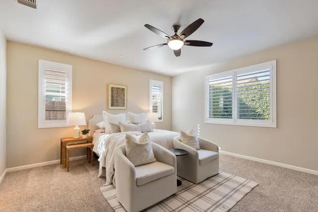 a room with a bed and a chandelier