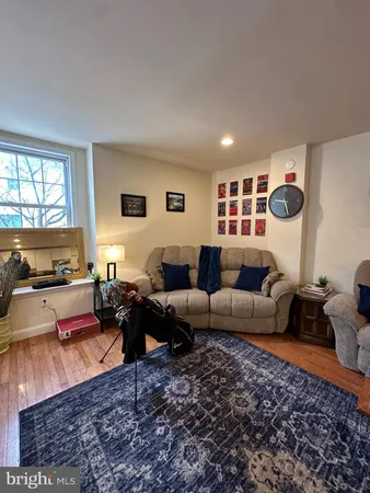 a living room with furniture or couch and a window