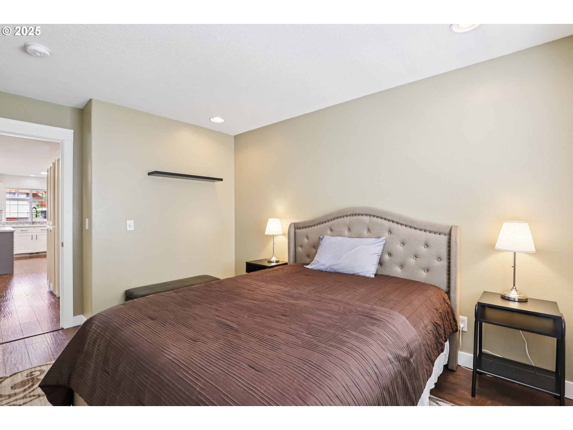425 Northwest 151st Street Vancouver, WA 98685 - Photo 20 of 31 a bedroom with a bed and a lamp
