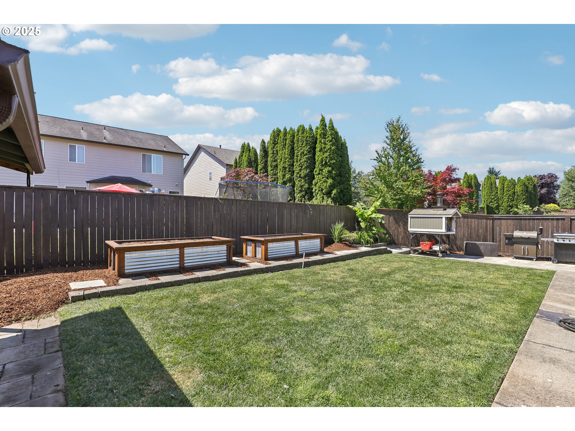 425 Northwest 151st Street Vancouver, WA 98685 - Photo 28 of 31 a view of a backyard with a garden and entertaining space