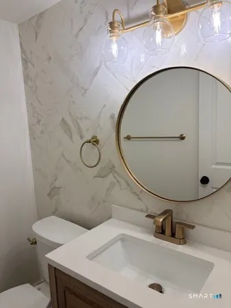 a bathroom with a sink and mirror