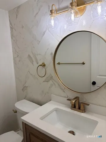 a bathroom with a sink and mirror