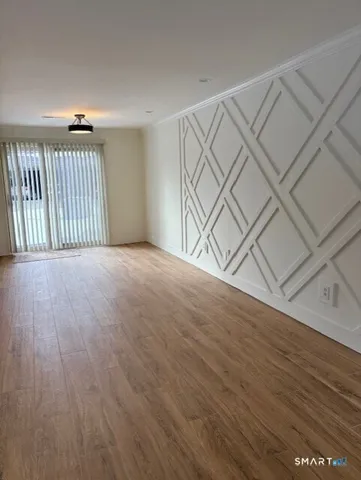 a view of a livingroom with wooden floor