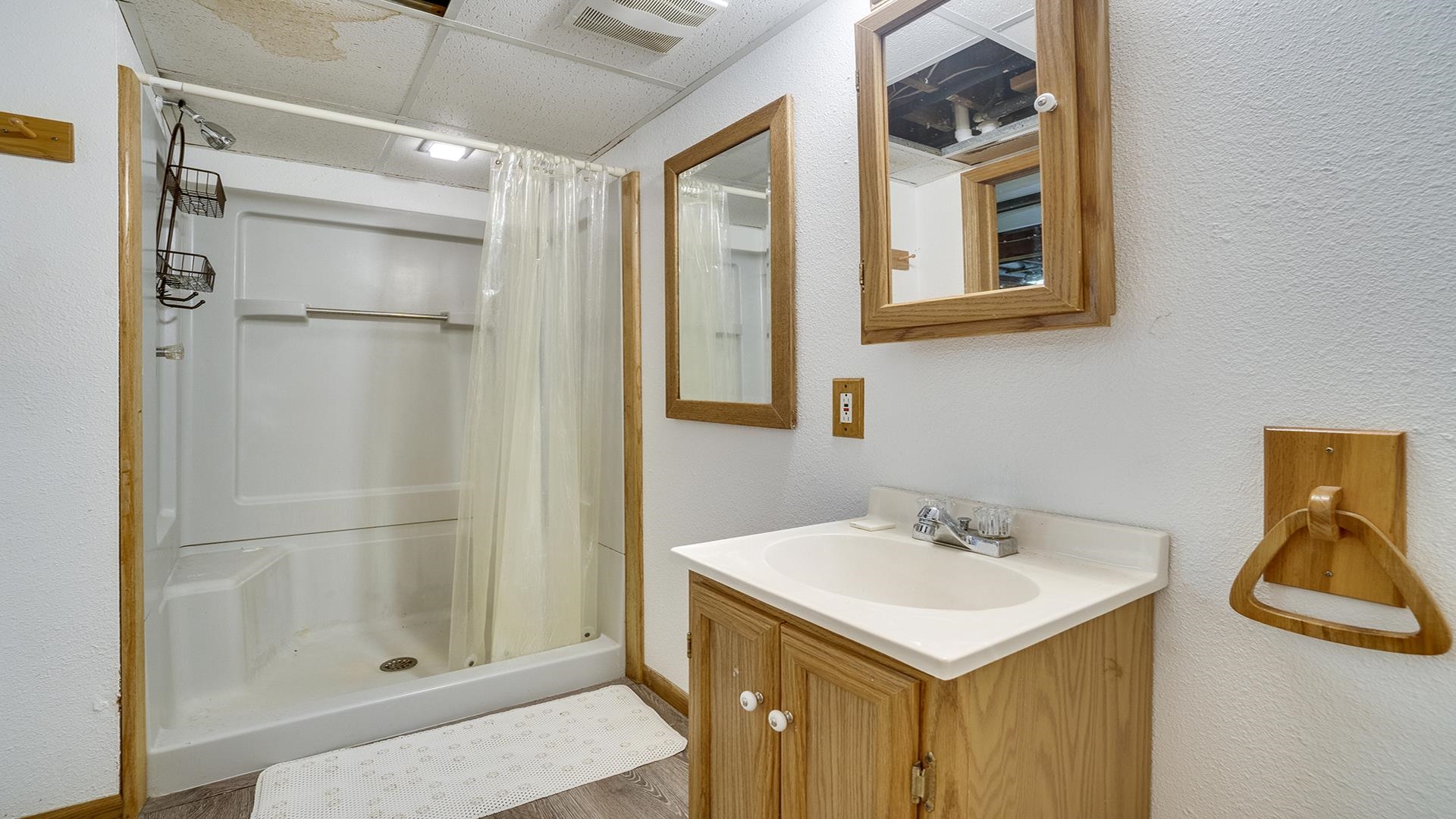 2428 Devon Avenue Loves Park, IL 61111 - Photo 23 of 26 a bathroom with a sink and a mirror