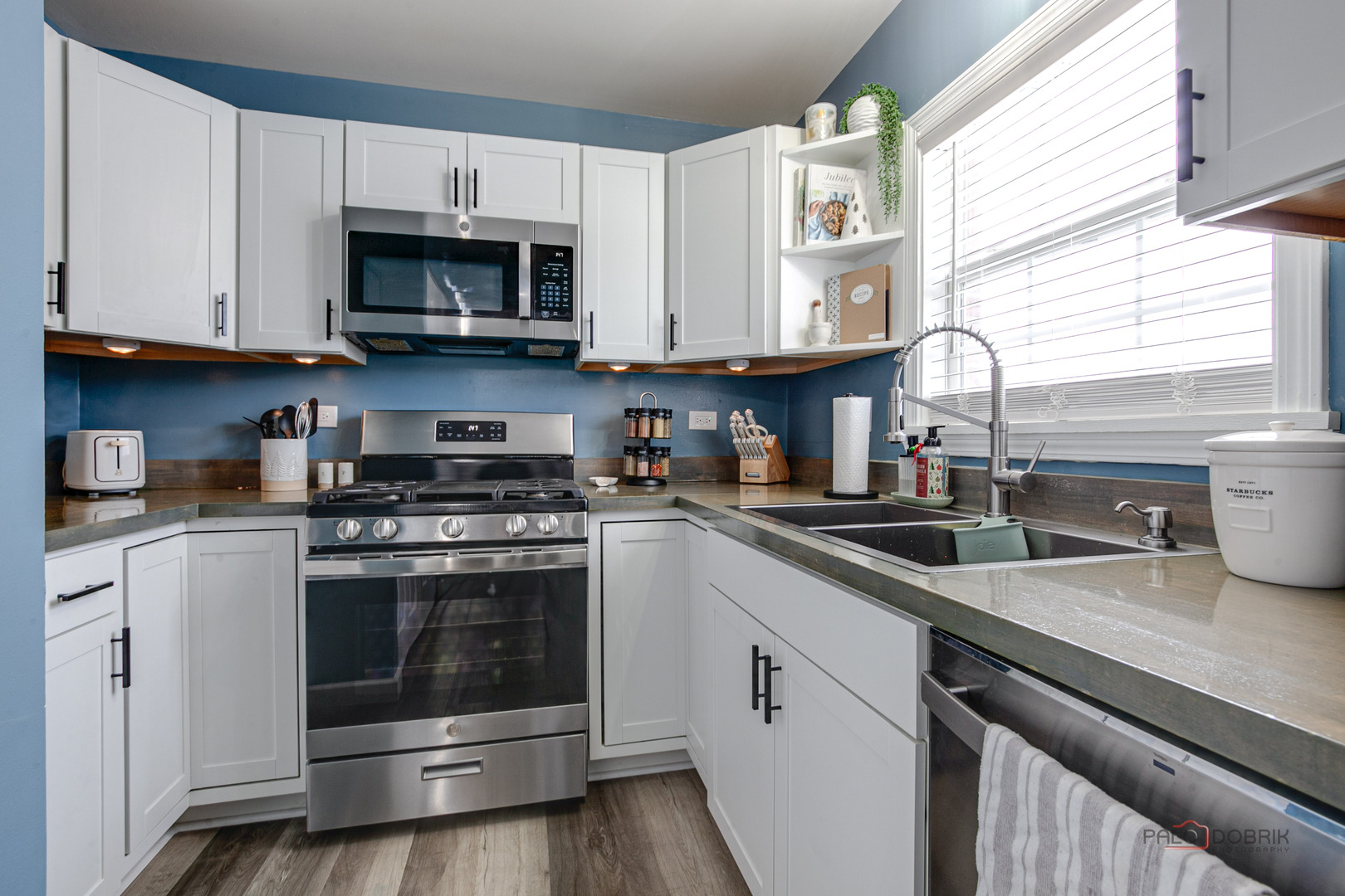 1502 Anderson Trail Zion, IL 60099 - Photo 11 of 30 a kitchen with stainless steel appliances granite countertop a sink a stove a microwave and cabinets