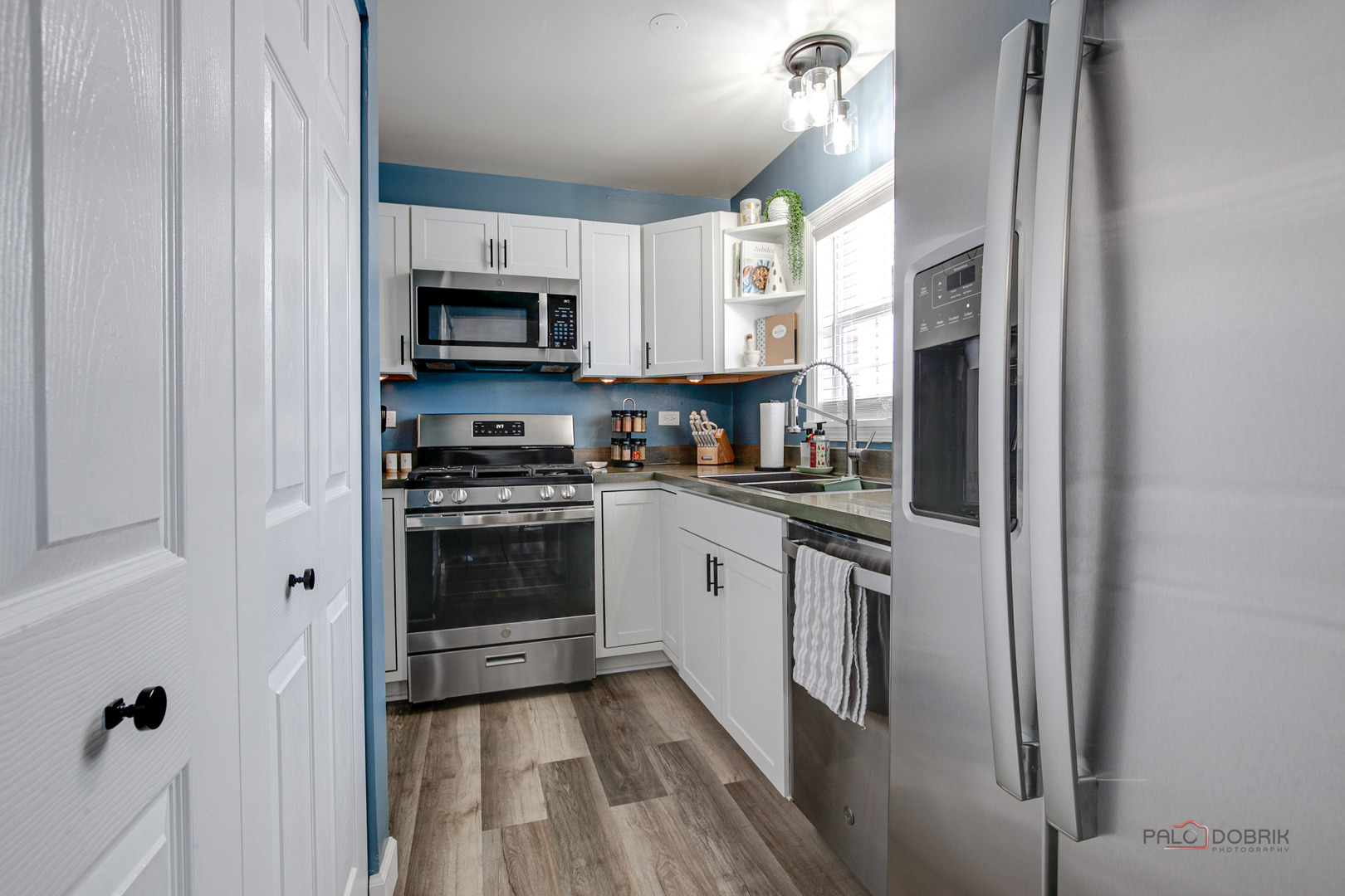 1502 Anderson Trail Zion, IL 60099 - Photo 12 of 30 a kitchen with stainless steel appliances a refrigerator sink and microwave