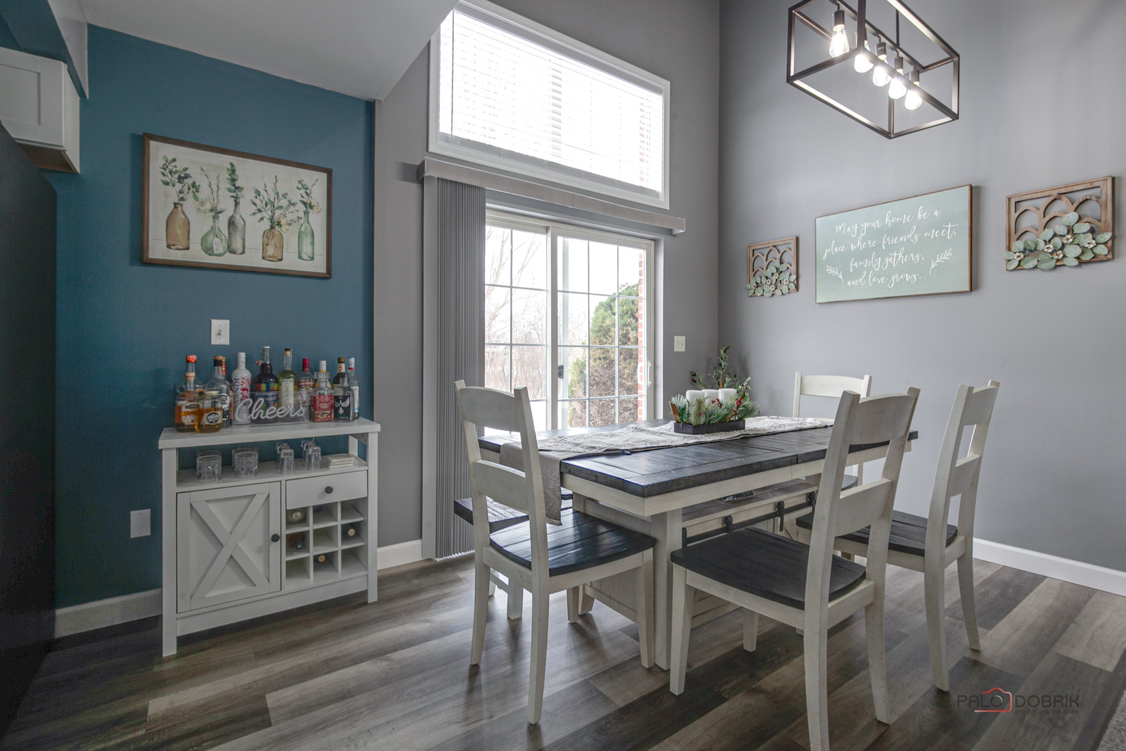 1502 Anderson Trail Zion, IL 60099 - Photo 9 of 30 a view of a dining room with furniture a chandelier and wooden floor