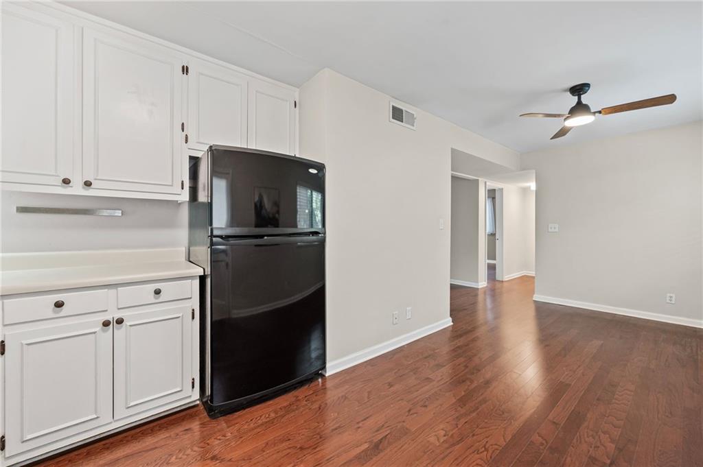 20 26th Street Northwest, Unit A1 Atlanta, GA 30309 - Photo 11 of 19 a kitchen with a refrigerator and a stove top oven