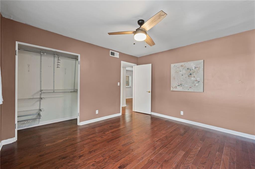 20 26th Street Northwest, Unit A1 Atlanta, GA 30309 - Photo 14 of 19 a view of an empty room with wooden floor