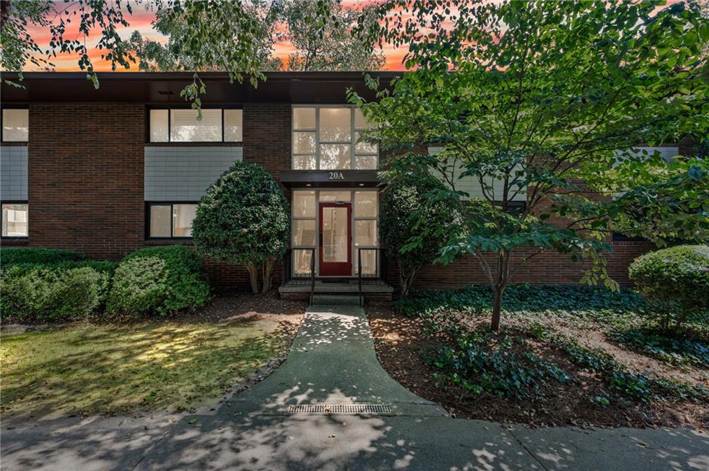20 26th Street Northwest, Unit A1 Atlanta, GA 30309 - Photo 18 of 19 a front view of a house with a yard