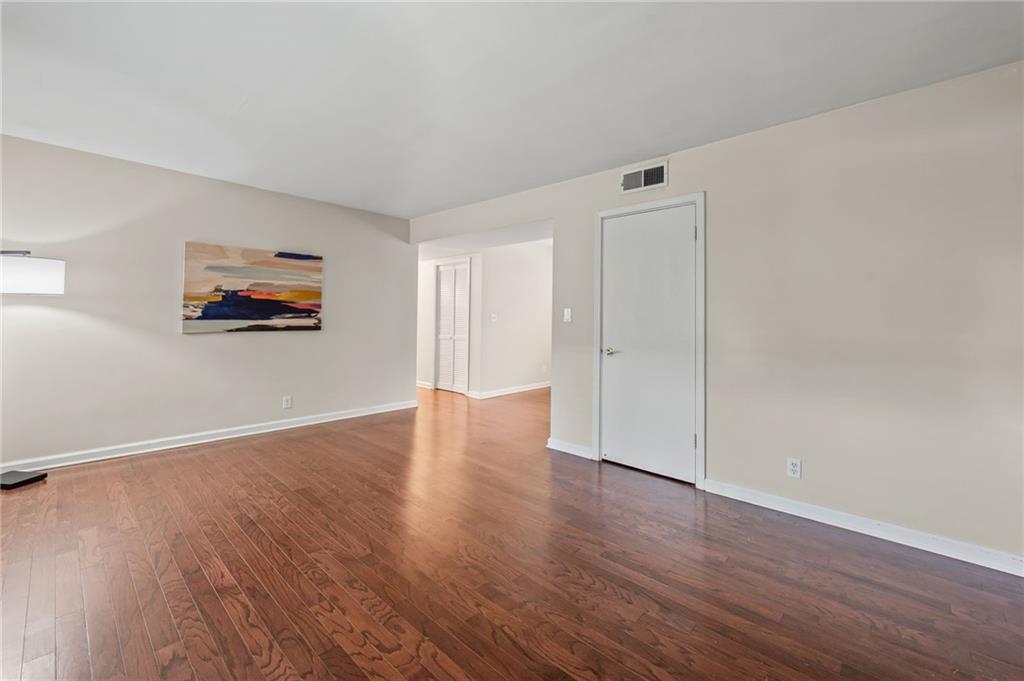 20 26th Street Northwest, Unit A1 Atlanta, GA 30309 - Photo 3 of 19 a view of a livingroom with wooden floor
