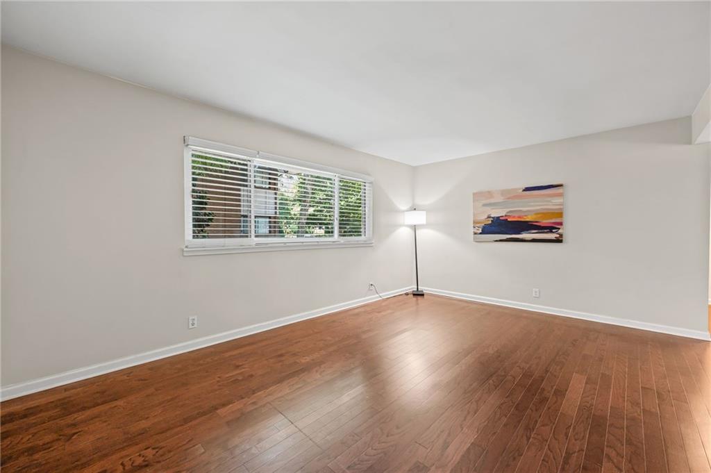 20 26th Street Northwest, Unit A1 Atlanta, GA 30309 - Photo 4 of 19 a view of a big room with wooden floor and windows