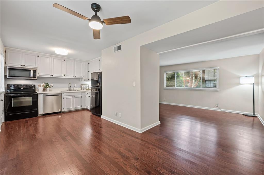 20 26th Street Northwest, Unit A1 Atlanta, GA 30309 - Photo 8 of 19 a view of kitchen with wooden floor electronic appliances and window