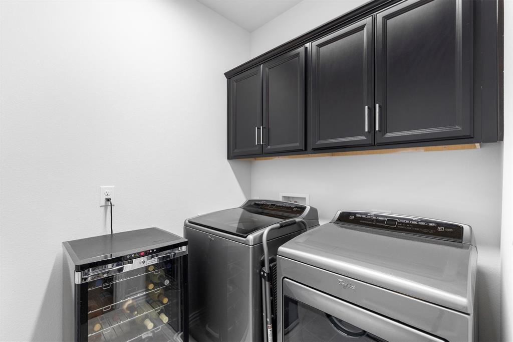 651 Watters Road, Unit 5205 Allen, TX 75013 - Photo 16 of 31 a utility room with dryer and washer