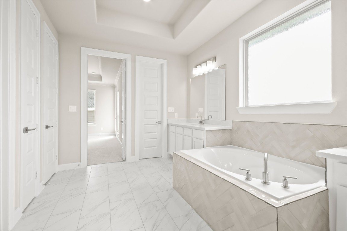 136 Peninsula Point Drive Montgomery, TX 77356 - Photo 12 of 30 a bathroom with a tub sink and mirror