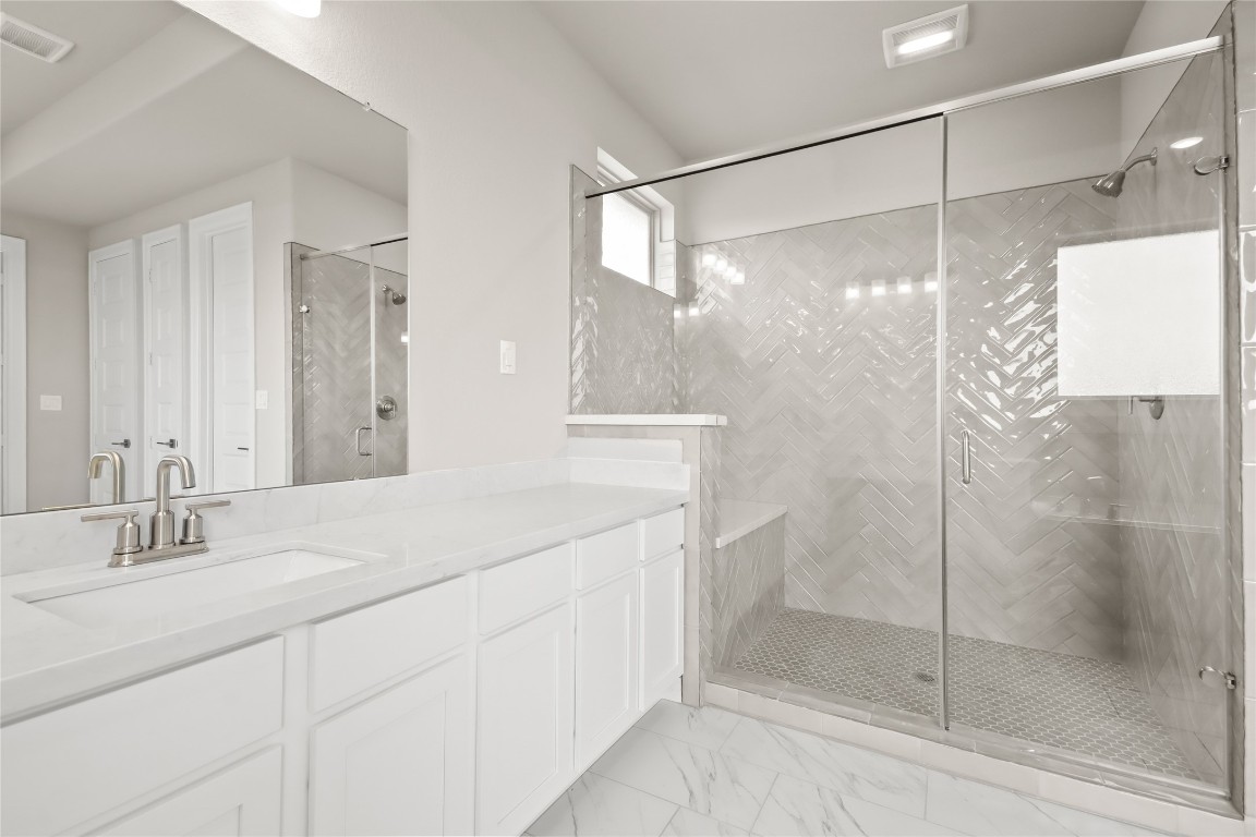 136 Peninsula Point Drive Montgomery, TX 77356 - Photo 13 of 30 a bathroom with a shower sink and mirror