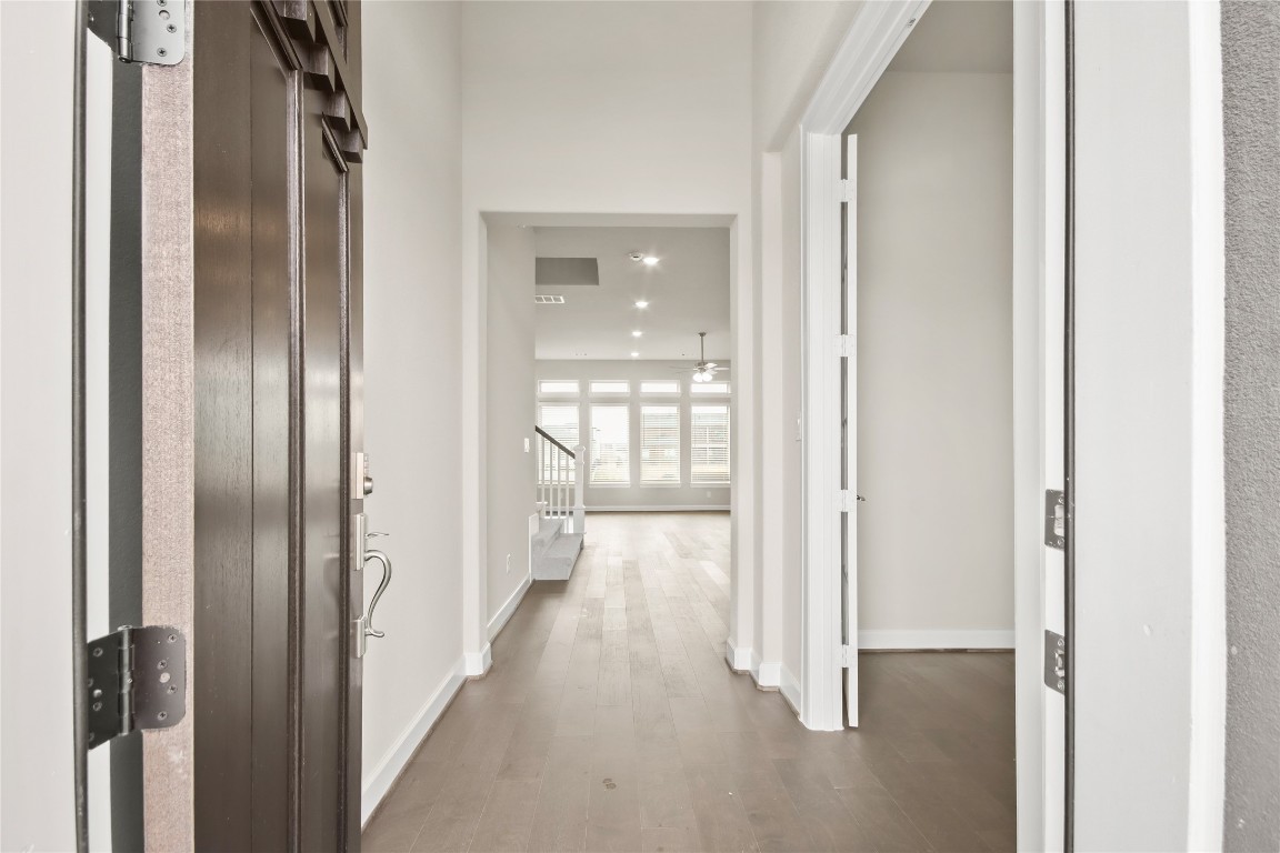 136 Peninsula Point Drive Montgomery, TX 77356 - Photo 2 of 30 a view of a hallway with wooden floor