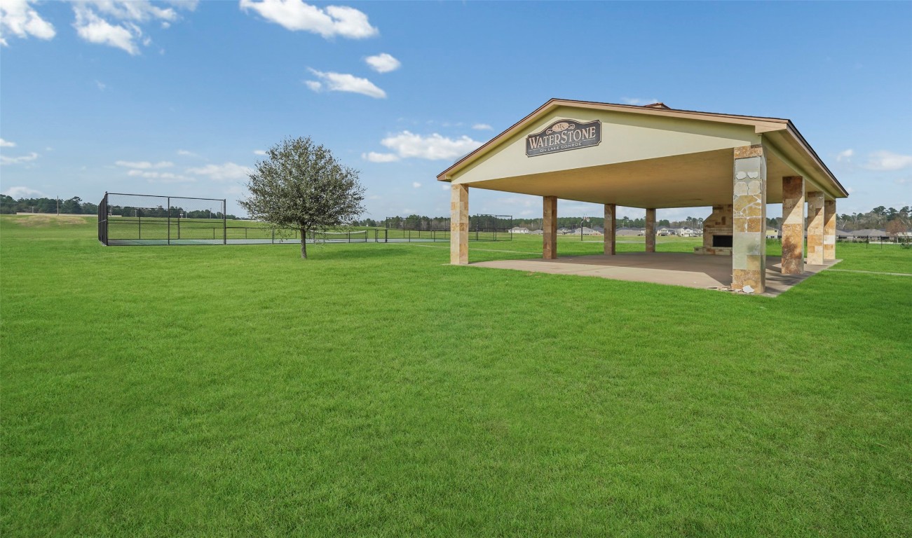 136 Peninsula Point Drive Montgomery, TX 77356 - Photo 24 of 30 a view of a house with a yard