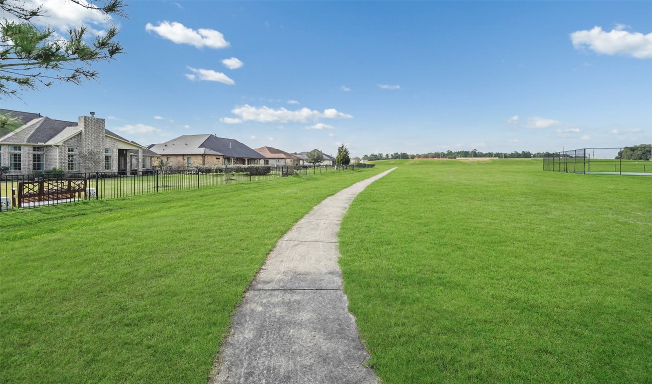 136 Peninsula Point Drive Montgomery, TX 77356 - Photo 25 of 30 a view of a green field in front of a house