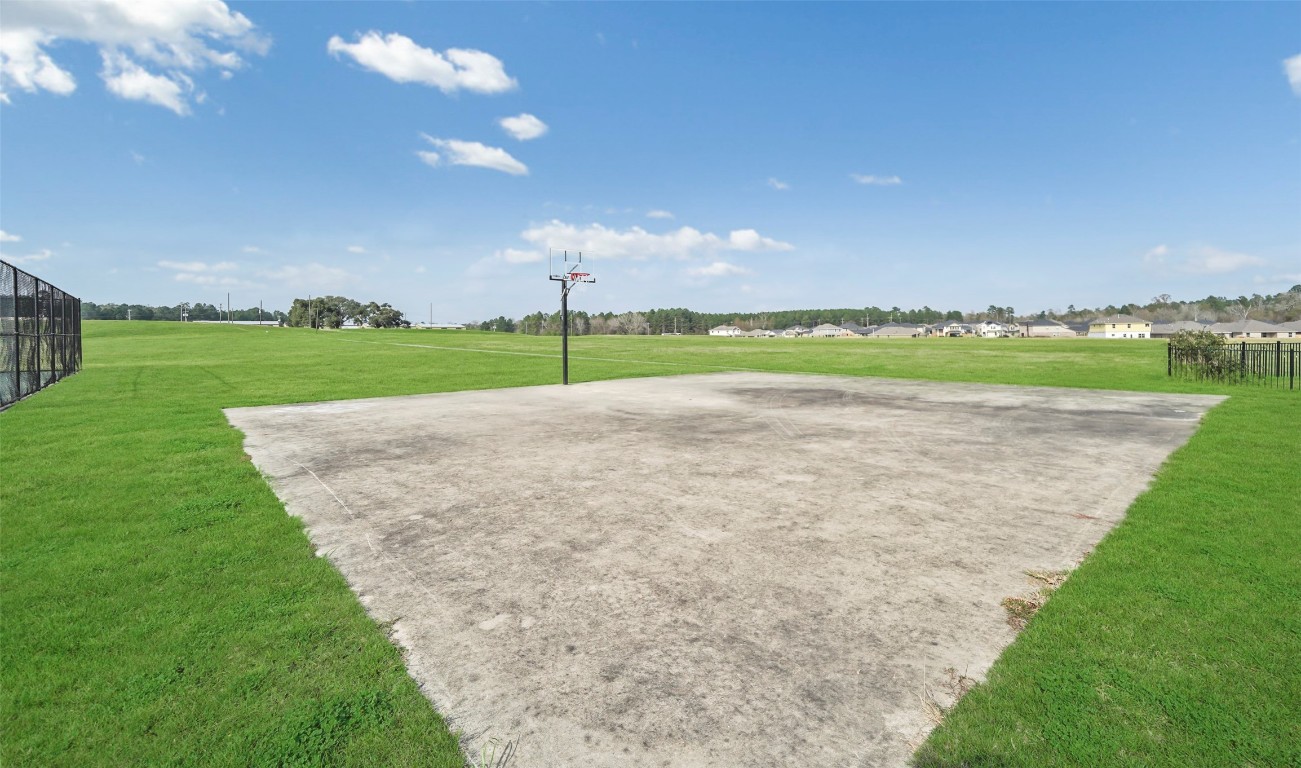 136 Peninsula Point Drive Montgomery, TX 77356 - Photo 26 of 30 a view of a golf course with a lake