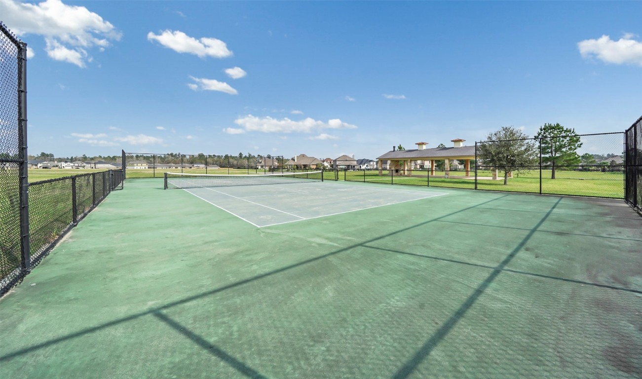 136 Peninsula Point Drive Montgomery, TX 77356 - Photo 27 of 30 a view of an outdoor space and tennis court