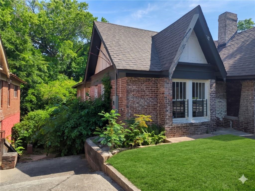665 Lexington Avenue Southwest Atlanta, GA 30310 - Photo 32 of 33 a front view of a house with a garden and plants