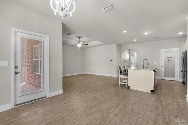 an entryway and livingroom with furniture