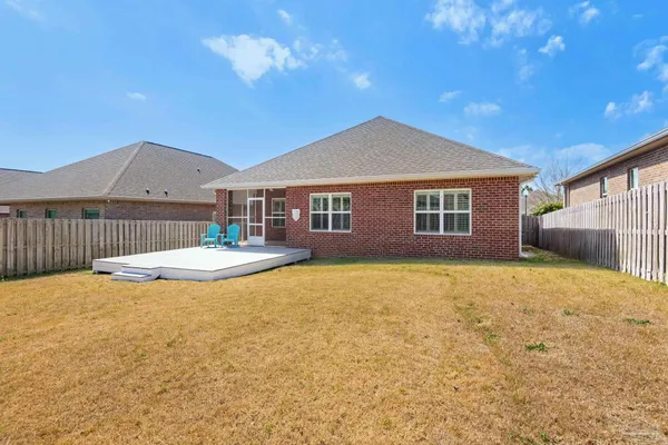 a view of a house with basketball court