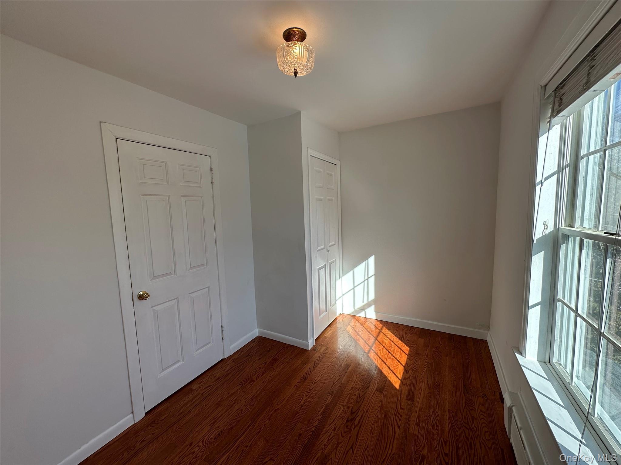 197 Johnson Road Scarsdale, NY 10583 - Photo 12 of 36 Bedroom featuring dark hardwood / wood-style flooring