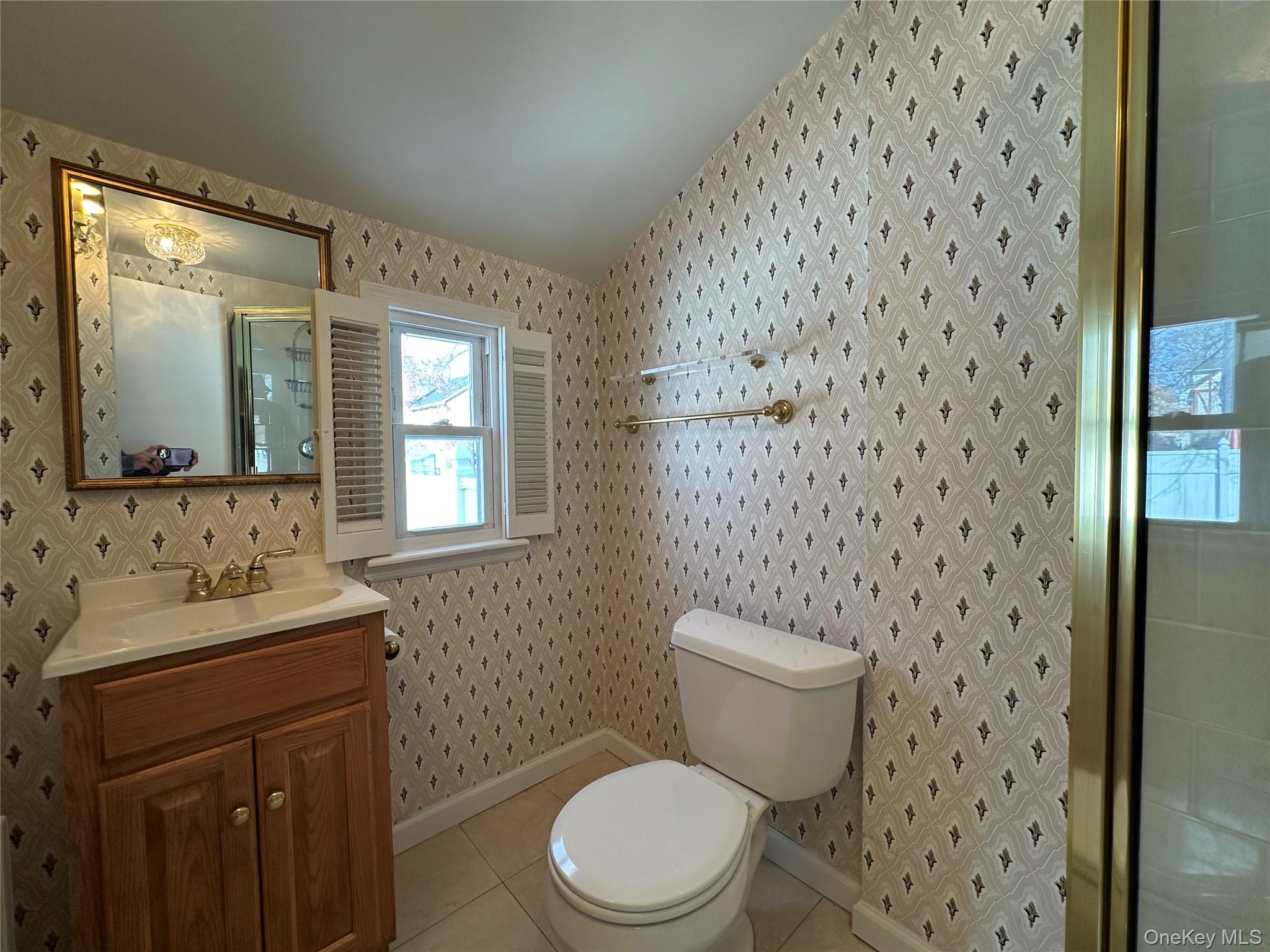 197 Johnson Road Scarsdale, NY 10583 - Photo 30 of 36 Bathroom featuring vanity, tile patterned floors, and toilet