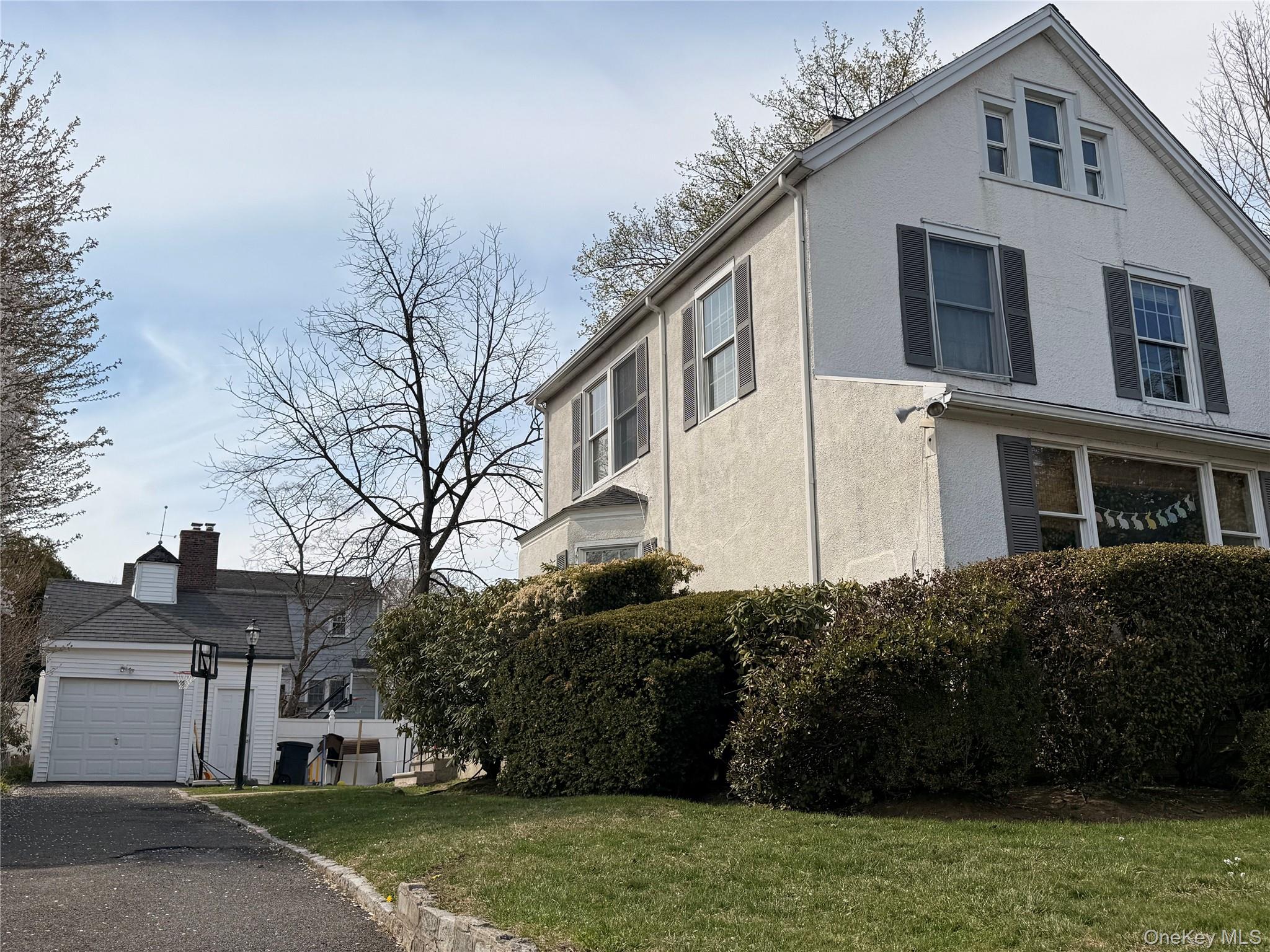 197 Johnson Road Scarsdale, NY 10583 - Photo 32 of 36 Large driveway with detached Garage and storage room next to the garage