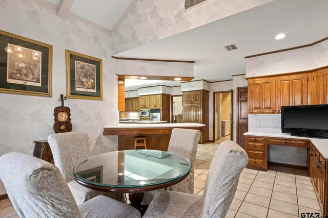 a bathroom with a toilet and a shower curtain