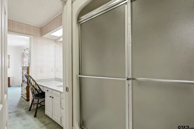 a bedroom with a bed a couch and dresser