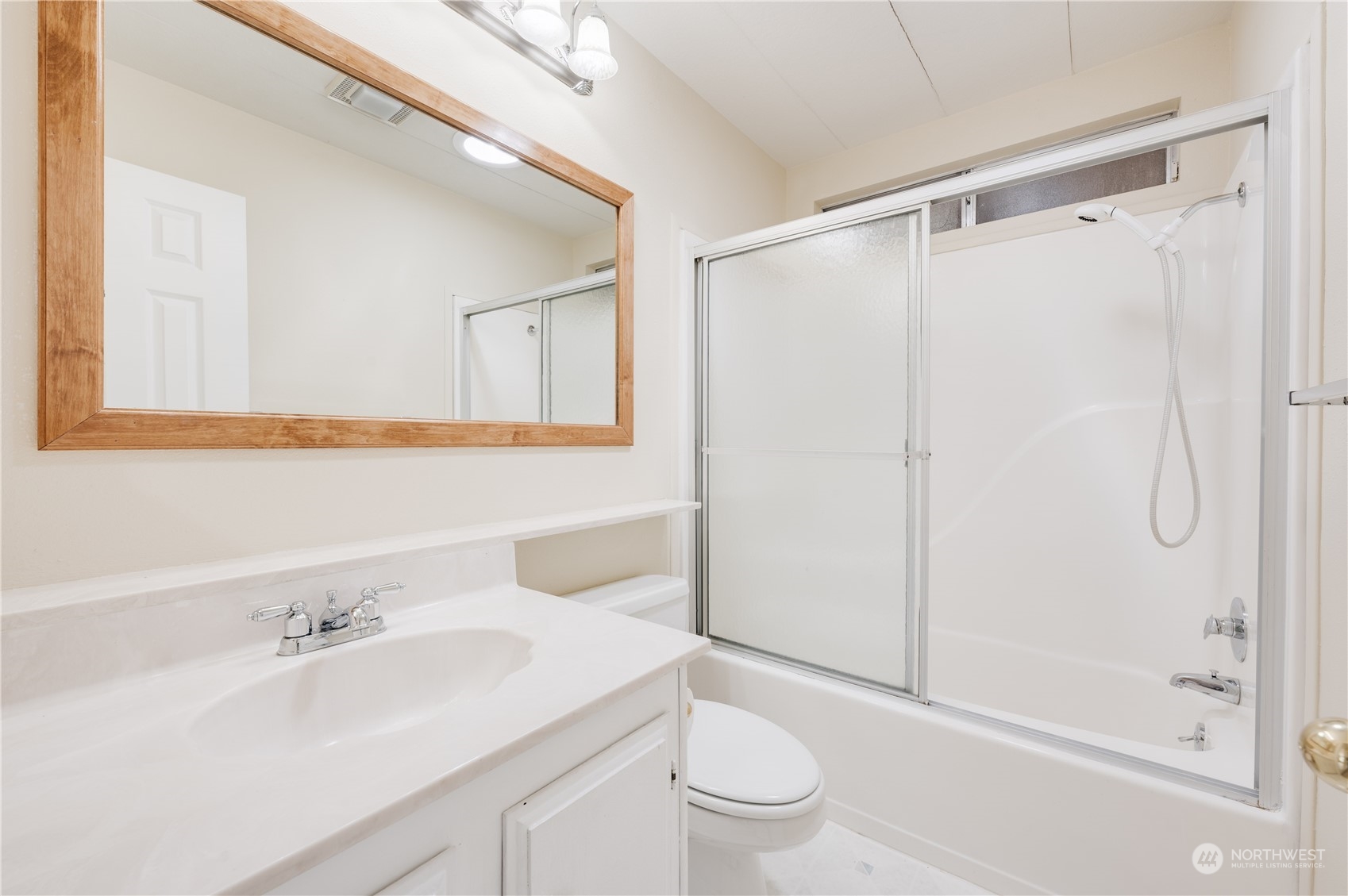 23803 Lake Drive West Bothell, WA 98021 - Photo 18 of 32 a bathroom with a sink a toilet and shower