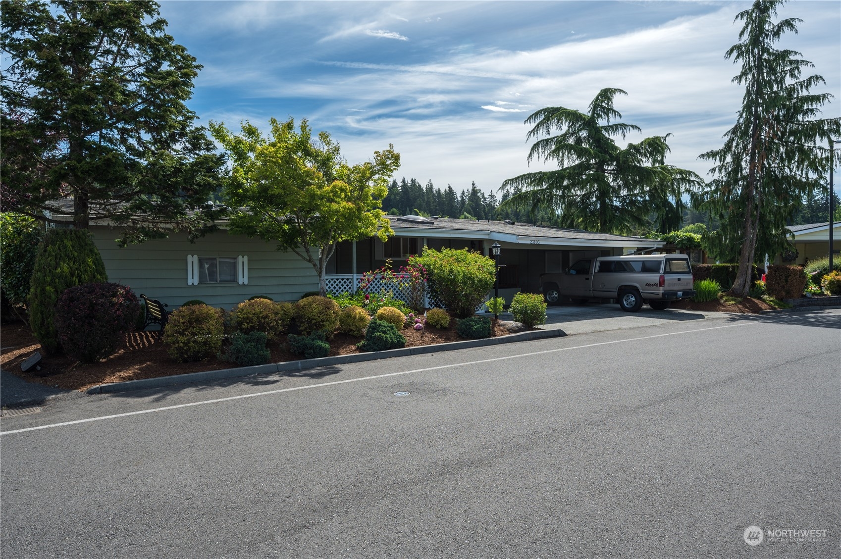 23803 Lake Drive West Bothell, WA 98021 - Photo 2 of 32 a view of a street with cars on road