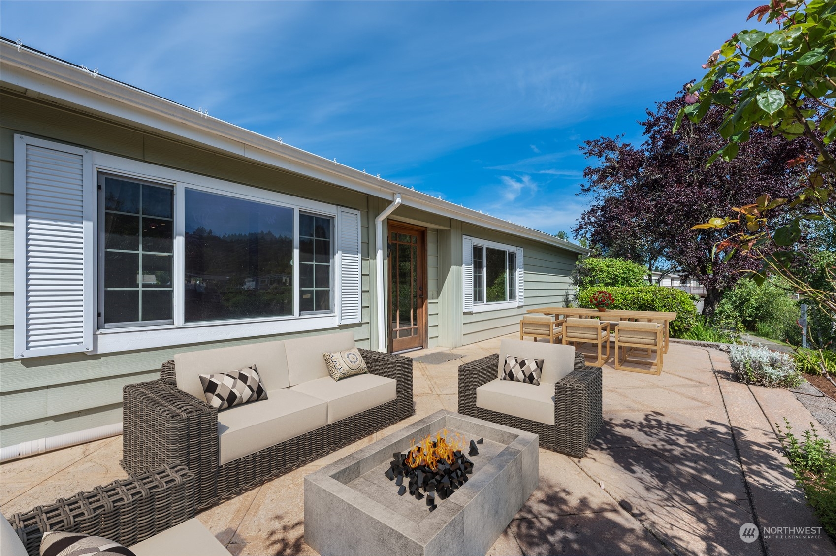 23803 Lake Drive West Bothell, WA 98021 - Photo 22 of 32 a view of a patio with couches table and chairs and potted plants