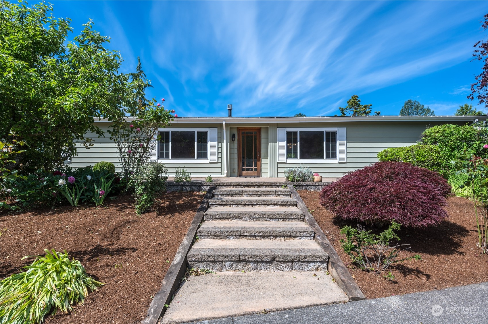 23803 Lake Drive West Bothell, WA 98021 - Photo 27 of 32 a front view of a house with a garden