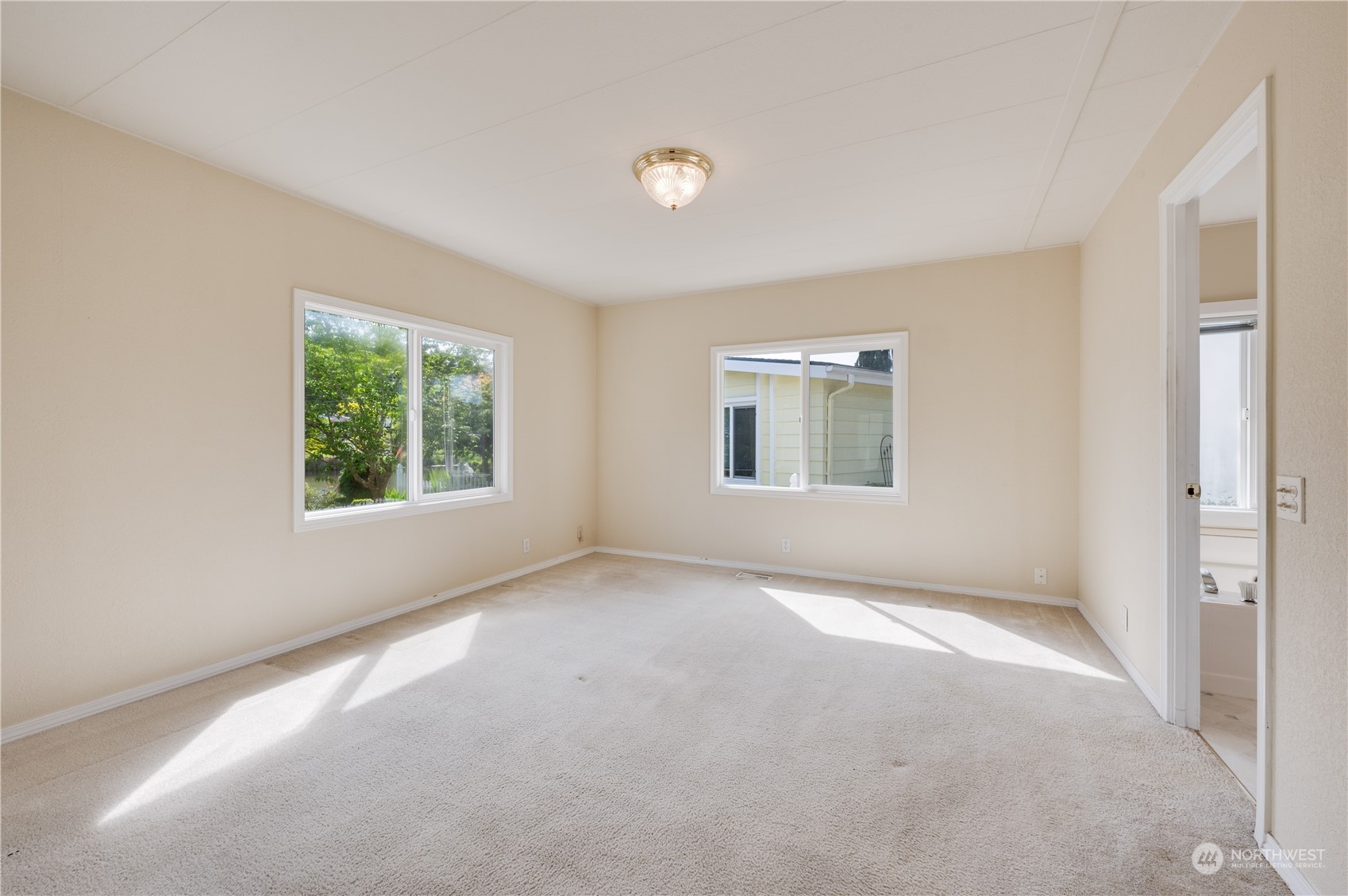 23803 Lake Drive West Bothell, WA 98021 - Photo 7 of 32 an empty room with windows and closet