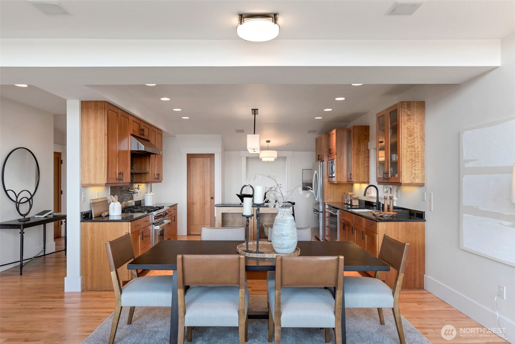 225 Ward Street Seattle, WA 98109 - Photo 14 of 36 a dining room with furniture a wooden floor and a large window
