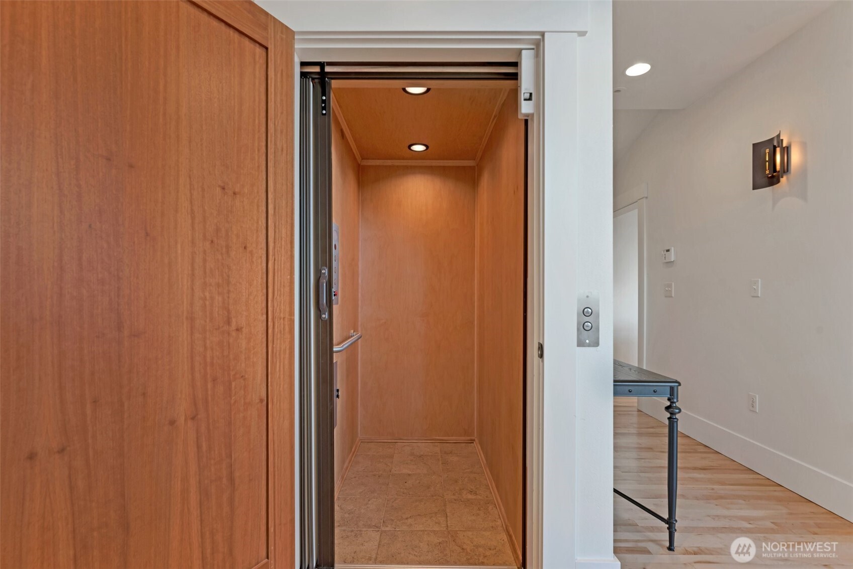 225 Ward Street Seattle, WA 98109 - Photo 16 of 36 a view of a hallway with wooden floor and staircase
